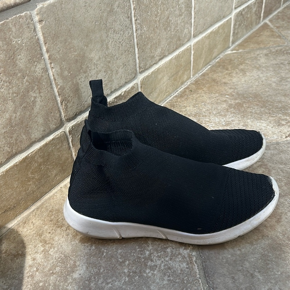 Black slip on sneakers